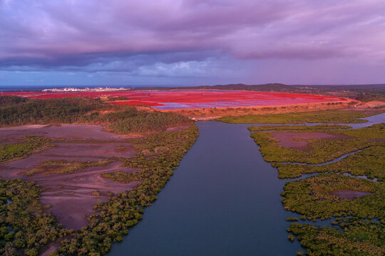Aerial view of mangroves and industrial red soil