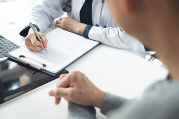 Doctor and patient at hospital office. Doctor working on diagnostic examination on men's health...
