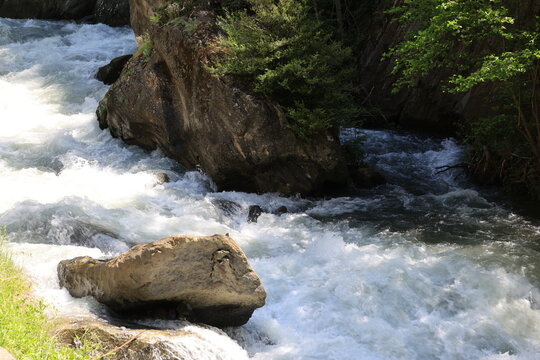 View of the crystal-clear Valira d'Orient river in La Massana, Andorra  