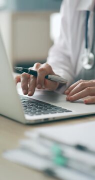 Healthcare professional working on patient documents