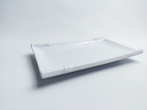 clean empty square plate isolated on white background