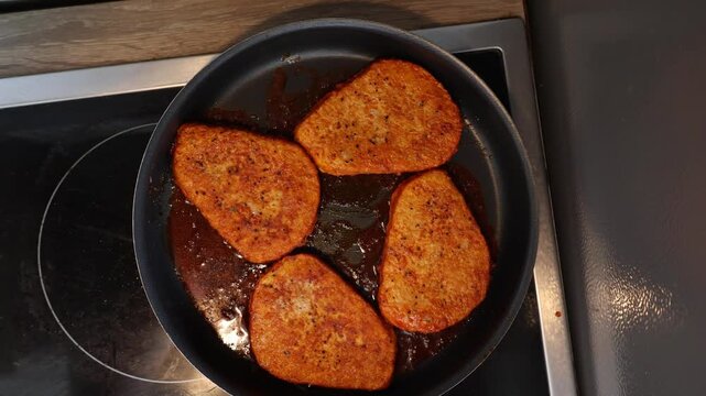 Vegan cutlets frying in a pan