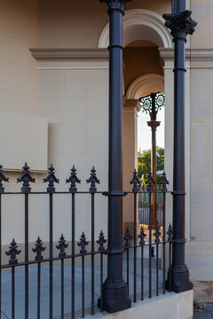Wrought iron railing fence around old restored historic building