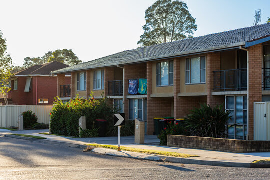 Australian and kangaroo flags hanging from balcony of unit home