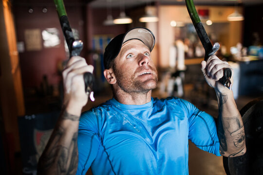 Focused athlete using ice tools for workout