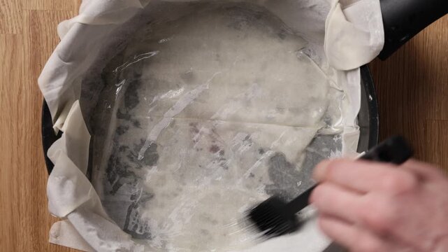Brushing Phyllo Dough With Olive Oil Top View