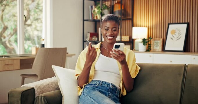 Phone, credit card and black woman on sofa in home with online shopping, ecommerce or internet banking. Technology, debit and female person with cellphone for order on retail website in living room.
