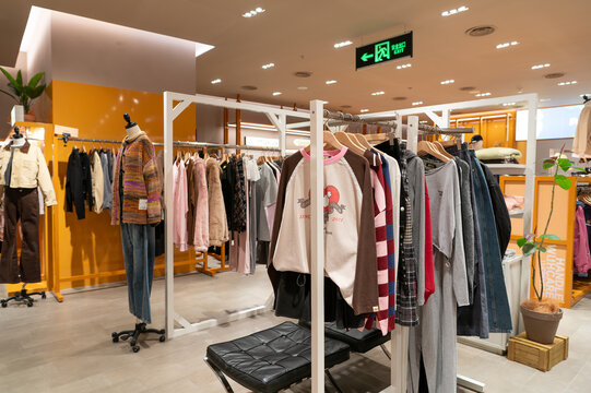 Apparel displayed on racks inside I.T store at KK Mall