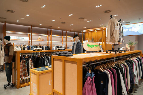 Apparel displayed on racks inside I.T store at KK Mall