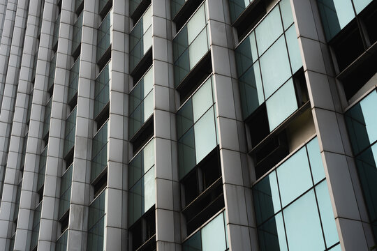 Abstract close up of modern office building facade with glass windows