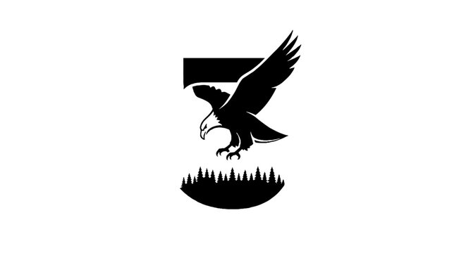 Majestic eagle soaring above forest silhouette.