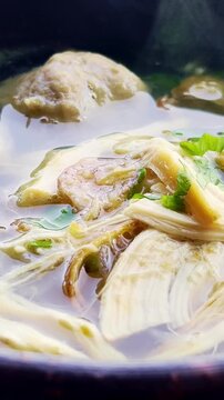 Vertical Meatball Soto Soup Close Up