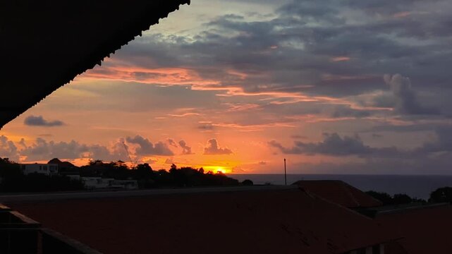 beutiful golden sunset shines beneath a vibrant sky, the viewer to back in the flowers and trees beauty of nature's summer embrace in sunset 4k footage videos.