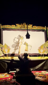 Vertical Dalang Performing Wayang Show