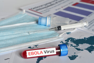 Blood tube for test detection of virus Ebola on papers documents. © Dan74