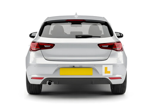 Rear view of a white learner driver car with L plate