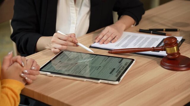 Attorney and client discussing legal matters during a consultation, highlighting legal advice, dispute resolution, professional guidance, and client-focused legal services.