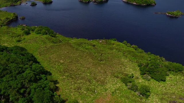 ide Drone Panorama of Killarney Lakes Rolling Green Hills and Distant Mountain Peaks Under Summer Sky