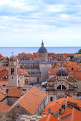 Obraz premium Aerial and above view of Dubrovnik old town, red and orange tile roof and walking the city wall around the old town on a sunset beautiful time, Croatia 