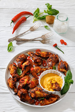 Roasted chicken wings appetizer with dip on plate
