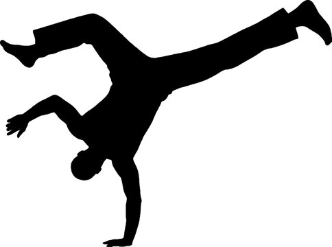 Silhouette of a person performing a handstand split.