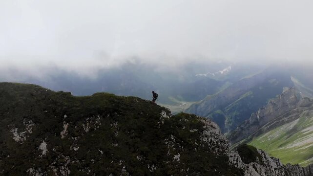 Hiking on the mountain ridge in the Appenzell Alps