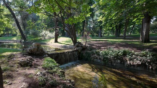 Romantic wooden bridge over a small pond in the Retiro Park in Madrid, Spain.