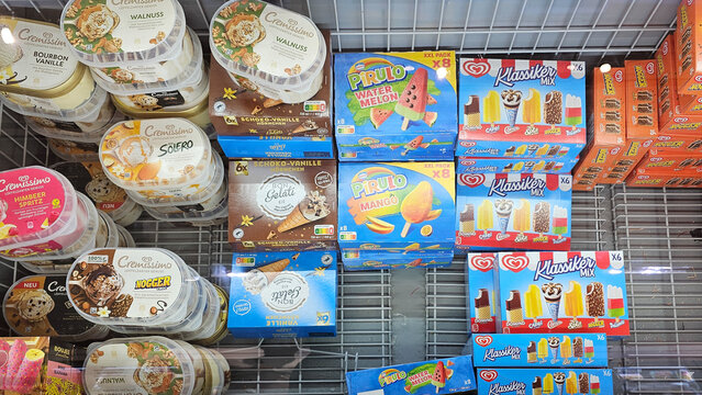Variety of frozen ice cream in supermarket freezer