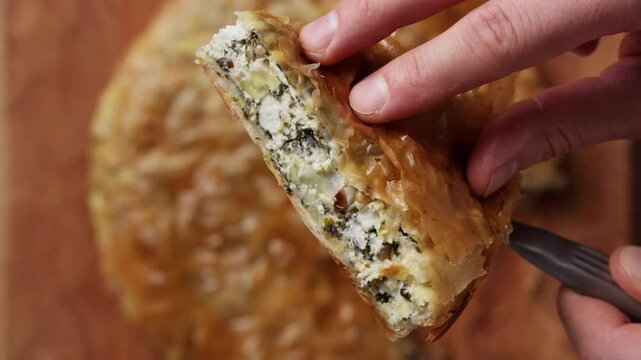 Slice of Greek Spinach Feta Pie Close Up Top View