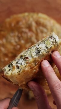 Slice of Greek Spinach Feta Pie Close Up Top View Vertical