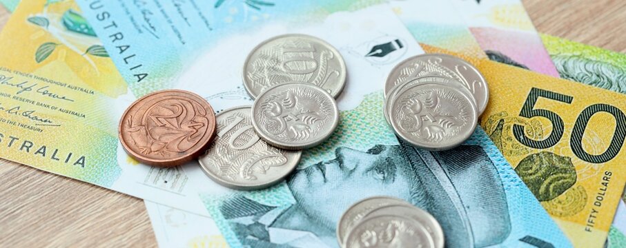 Australian dollar money bills and coins on table. Australia cash of AUD currency close up