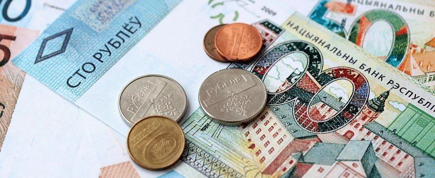 Belarusian ruble money bills and coins on table. Belarus cash of BYN currency close up