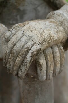 Close-Up of Weathered Stone Joined Hands of Ancient Buddhist Temple Statue at Prasat Vimean Koh Pos Kien Svay Cambodia