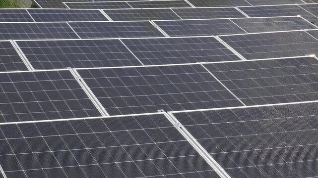 The Concept of Green Energy in an Urban Environment. Solar panels on the roofs of old apartment buildings. A rooftop solar power plant.