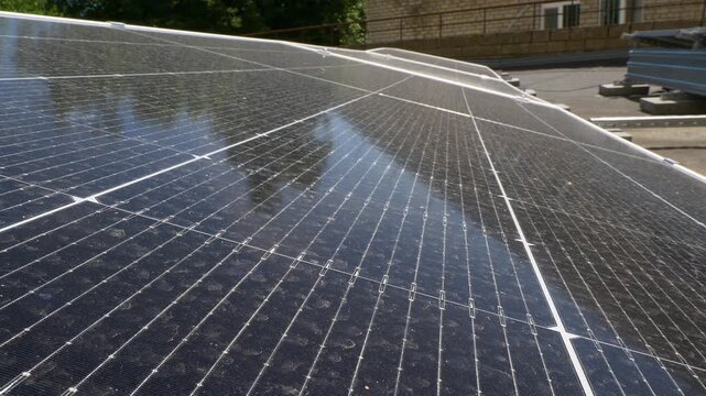 The Concept of Green Energy in an Urban Environment. Solar panels on the roofs of old apartment buildings. A rooftop solar power plant.