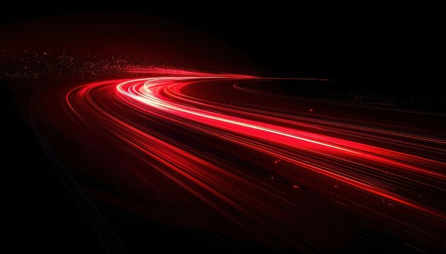 Abstract red light trails streaking across a dark background, suggesting speed and motion.
