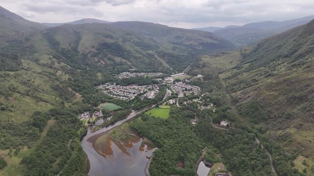 Aerial drone push forward shot of Loch Leven at the village Kinlochleven, part of the West Highland Way in Scotland.