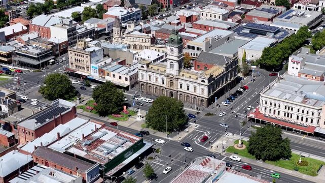 Zoom out from Ballarat city Town Hall building in CBD downtown streets and houses.