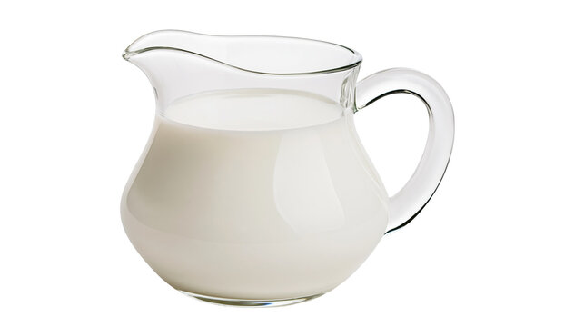 Glass creamer pitcher filled with white milk