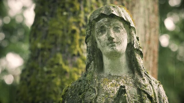 Vilnius, Lithuania &ndash; July 5, 2026: Close-up of St. Mary statue in the rain at Bernardine Cemetery
