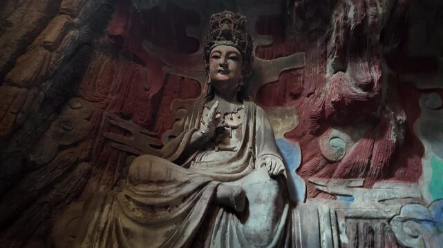 Dazu, China: Cinematic ootage of a bodhisattva statue, part of Baodingshan grottoes in Dazu rock carvings, famous rock art in Chongqing, one of China most famous grotto. 