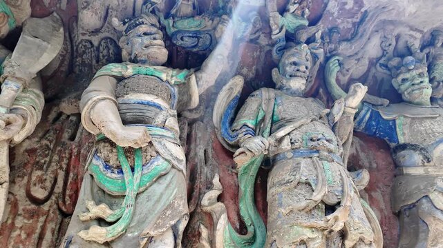 Dazu, China: Panoramic footage of ancient statues, part of Baodingshan grottoes in Dazu rock carvings, famous rock art in Chongqing, China