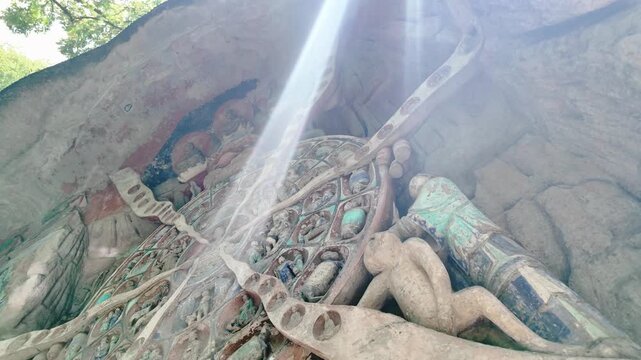 Dazu, China: Tilt down footage of the Buddhist wheel of life, part of Baodingshan grottoes in Dazu rock carvings, famous cave rock art in Chongqing, China