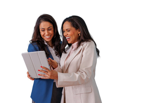 Two smiling multi-ethnic business women collaborating on a digital tablet, sharing ideas and laughing together on transparent background
