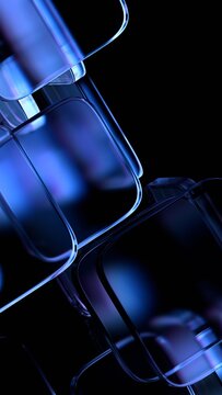 Abstract blue glass blocks on a black background, vertical 3d render