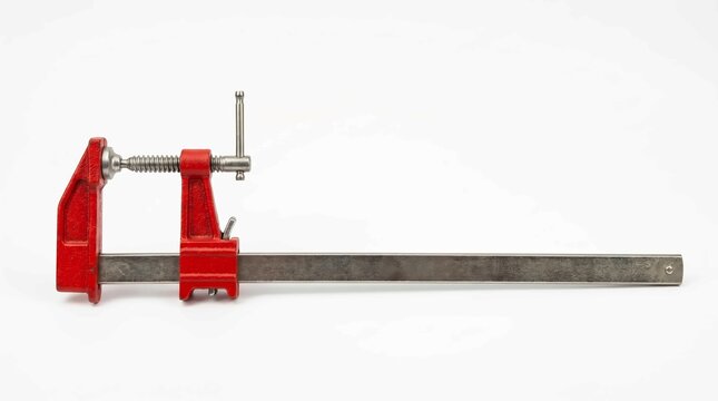Heavy duty red metal bar clamp tool for professional woodworking projects isolated on white background