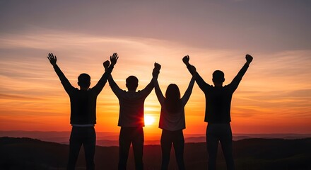 Fototapeta premium Silhouettes of four friends with arms raised in victory against sunset sky, celebrating friendship.