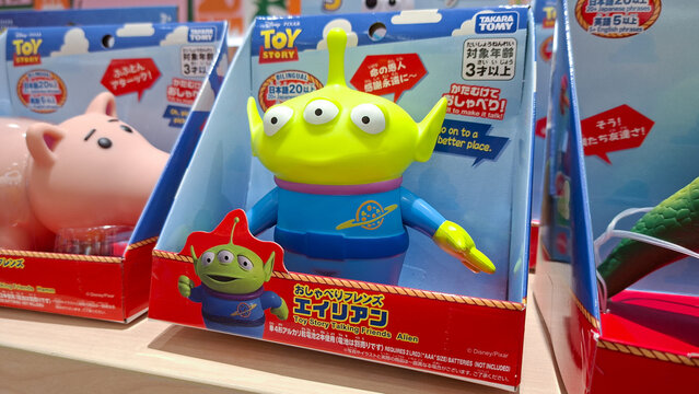 Green alien three eyes talking toy figure in original red paper box package from toy story movie character displayed on shop shelf on June 17, 2026 in Bangkok, Thailand.