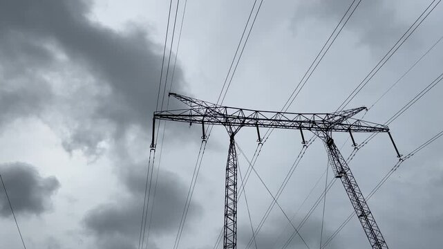 High voltage power lines. Helicoper inspecting the functionallity with electricity distribution and pylons. 