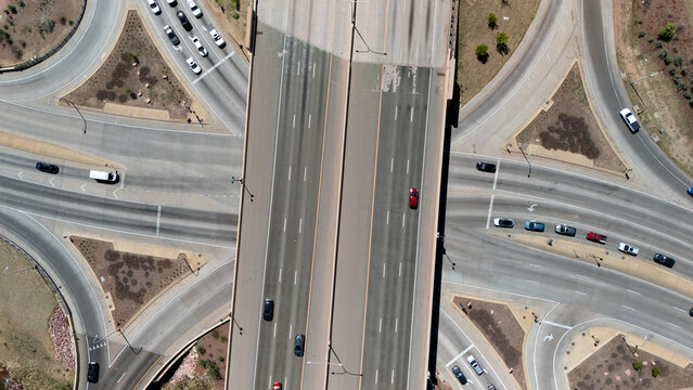 Top down aerial view of highway interchange junction on I-25 in Colorado Springs with traffic